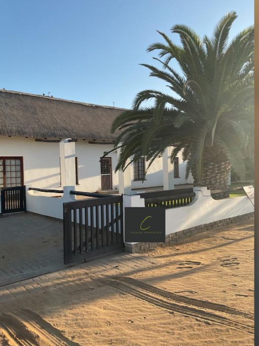 For Sale: Henties Bay Central House with 5 bedrooms, en-suite baths, and gardens.