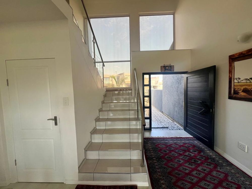 Entrance way to the house and stairs leading to first floor