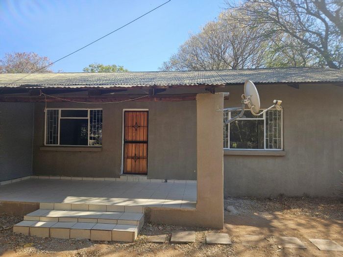 House To Rent in Hoedspruit Central: 2 beds, 2 baths, fenced yard, carport.