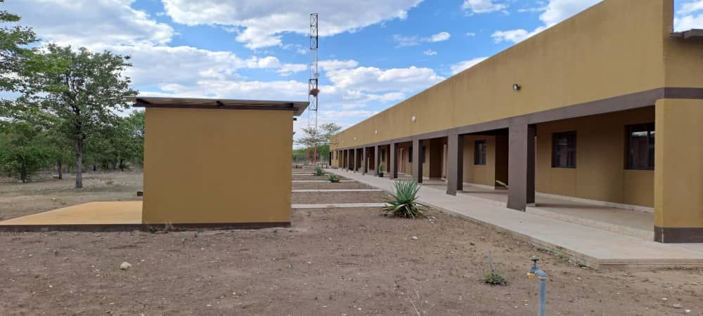 Front side view Of the Lodge building with the back view of the shade facility.