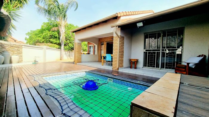 For Sale: Equestria Townhouse with pool, double garage, and recreational facilities.