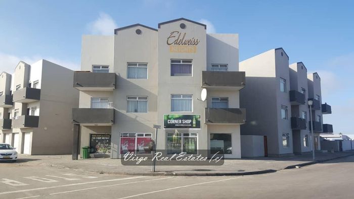 2-Bedroom Apartment For Sale in Walvis Bay Central with basement parking and open-plan living.