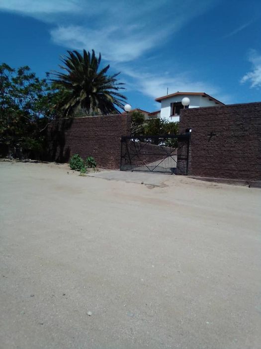 For Sale: Spacious Luderitz Central House with Flat, Garages, Patio, and Indoor BBQ