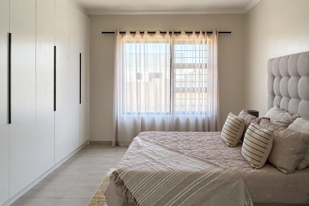 Main bedroom with plenty of cupboards and ensuite bathroom.