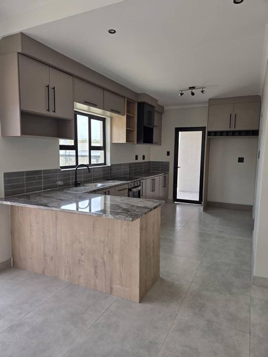 Khomasdal House For Sale: 3 beds, flat, garage, electric fence, paved yard.