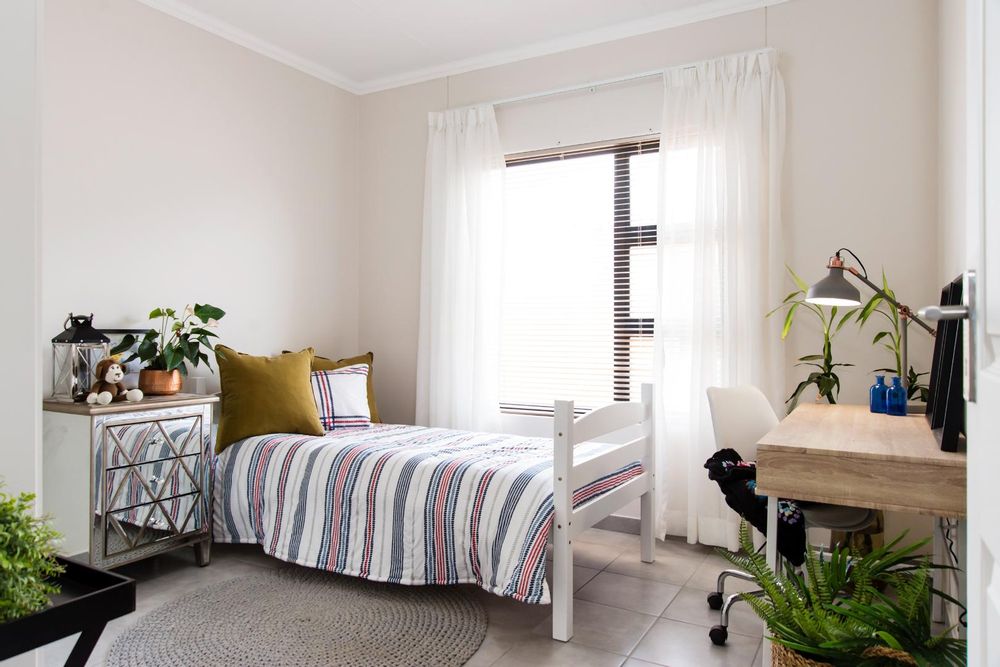 Fourth bedroom with built-in cupboards.