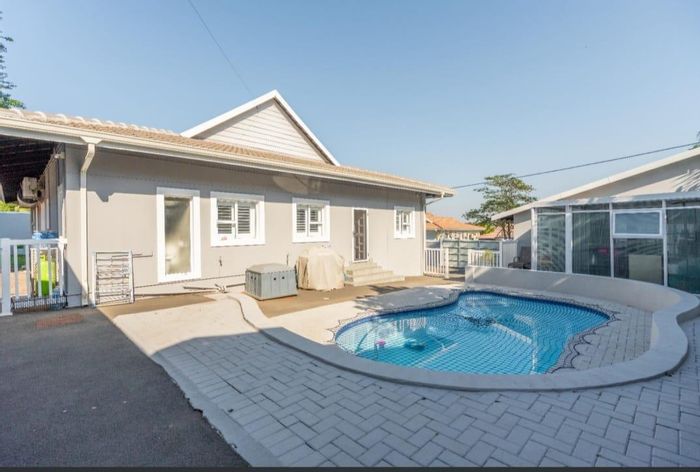 For Sale: House in Durban North Central with pool, guest suite, and security features.