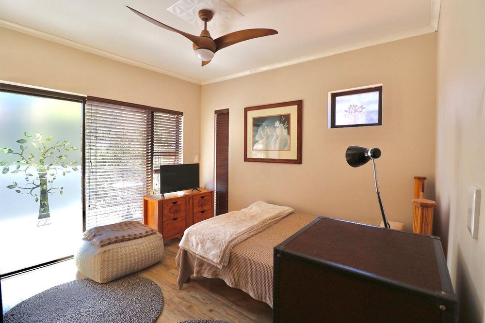 Main bedroom with sliding door to balcony