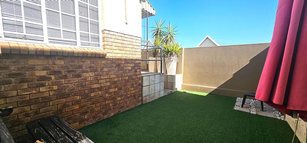 Astro turf private garden in front