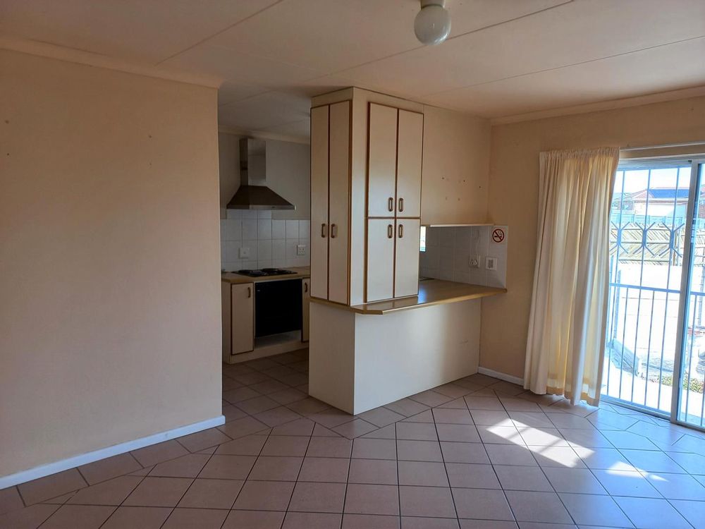 Same Open Plan Living Area - with part of the Kitchen at the back.