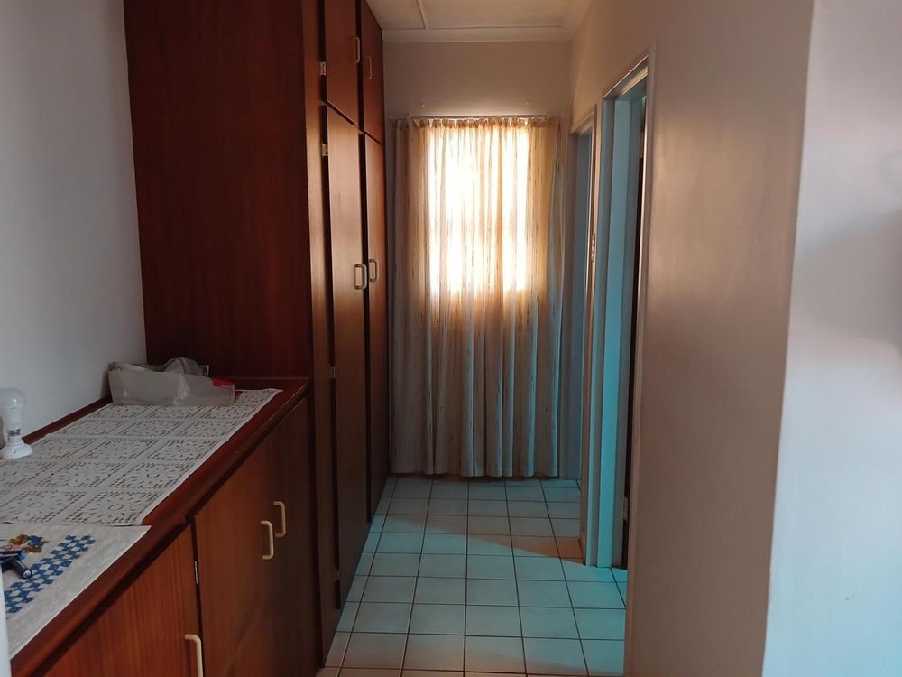 Now accessing the Bathroom (on our right) and LOTS of built-in cupboards on our left.