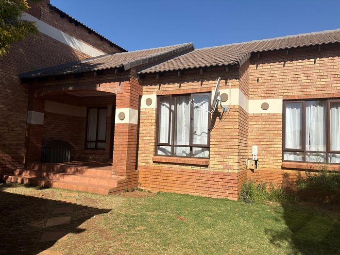 For Sale: Mooikloof Ridge Townhouse with garden, garage, and open-plan living.