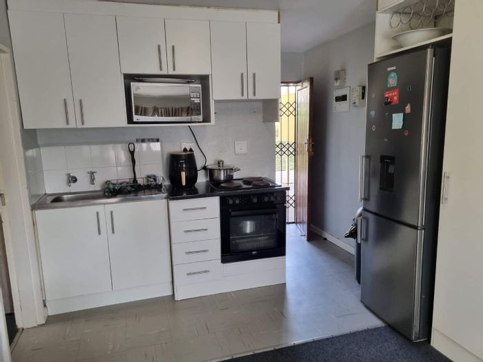 2-Bedroom Apartment For Sale in Amalinda with secure complex and play areas.