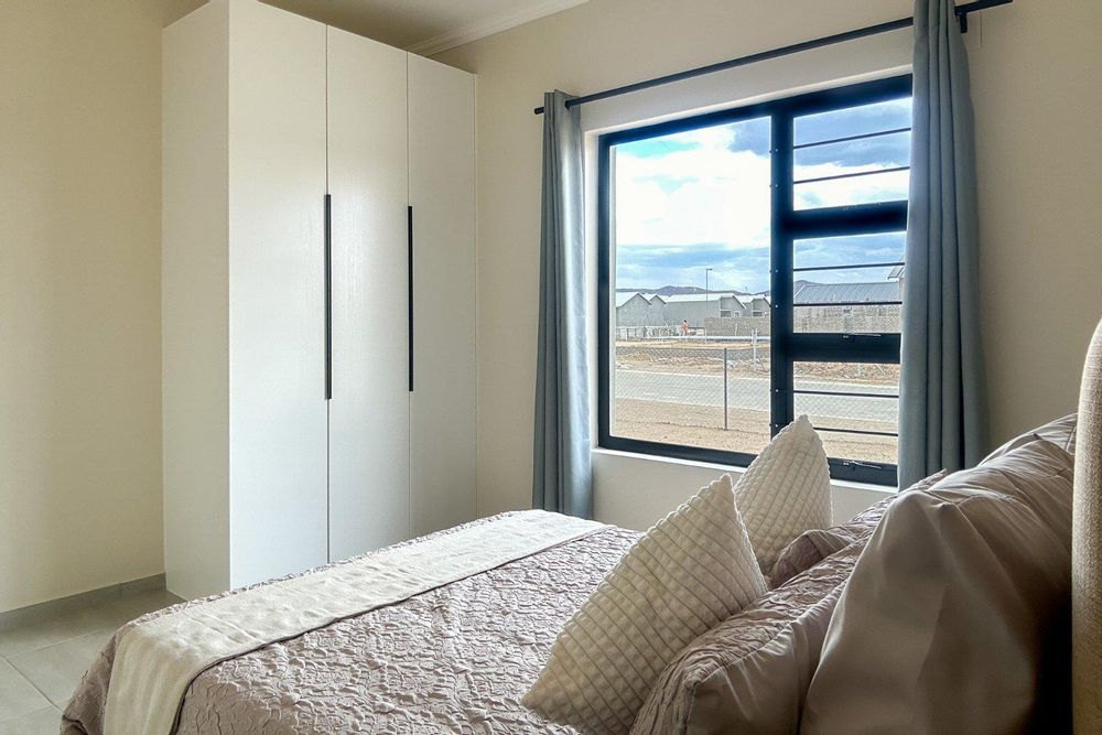 Third bedroom with built-in cupboards.