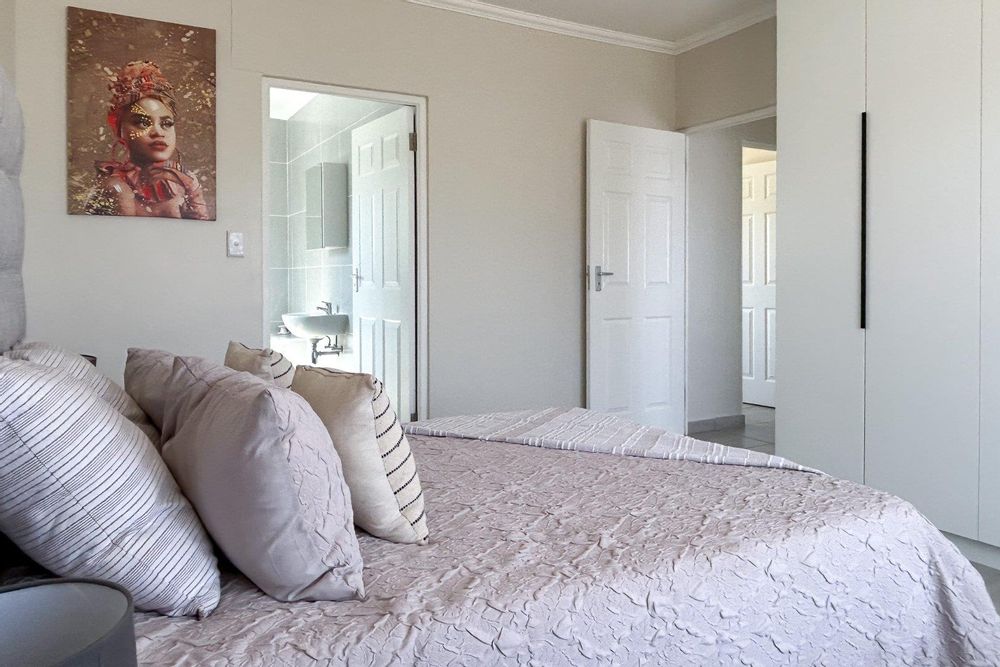 Main bedroom with plenty of cupboards and ensuite bathroom.