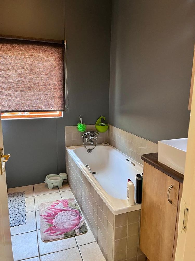 Bathroom with a shower and a bathtub