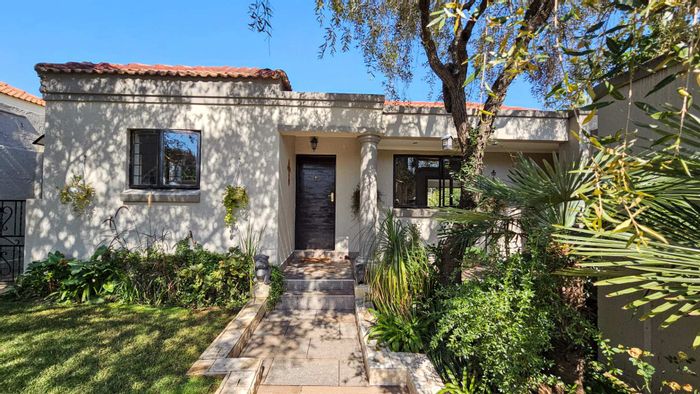 For Sale: Douglasdale Townhouse with 2 beds, koi pond, and double garage.