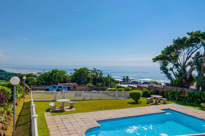Amanzimtoti Townhouse For Sale: Sea views, pool access, pet-friendly, renovated interior.