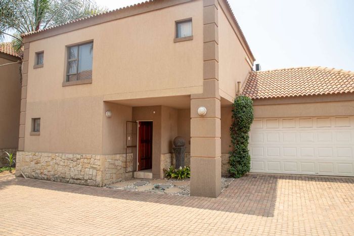 For Sale: Zuurfontein Townhouse with garden, double garage, and prepaid electricity.