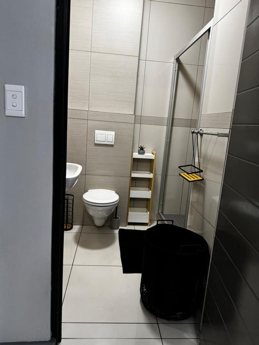 To Rent: Apartment in Southern Industrial Area with balcony, furnished, and open-plan living.