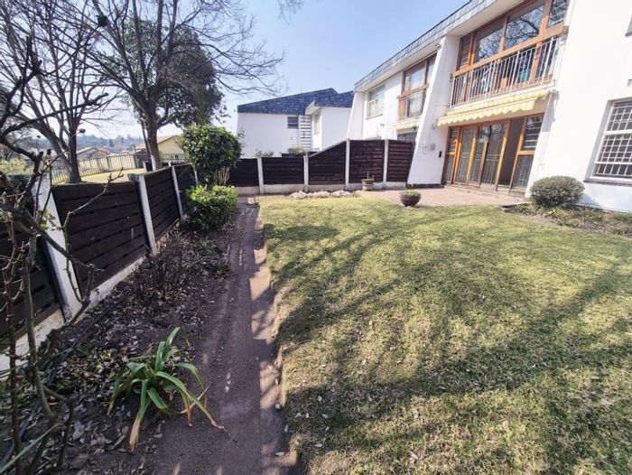 For Sale: Townhouse in Corlett Gardens with private garden, clubhouse, and pool access.