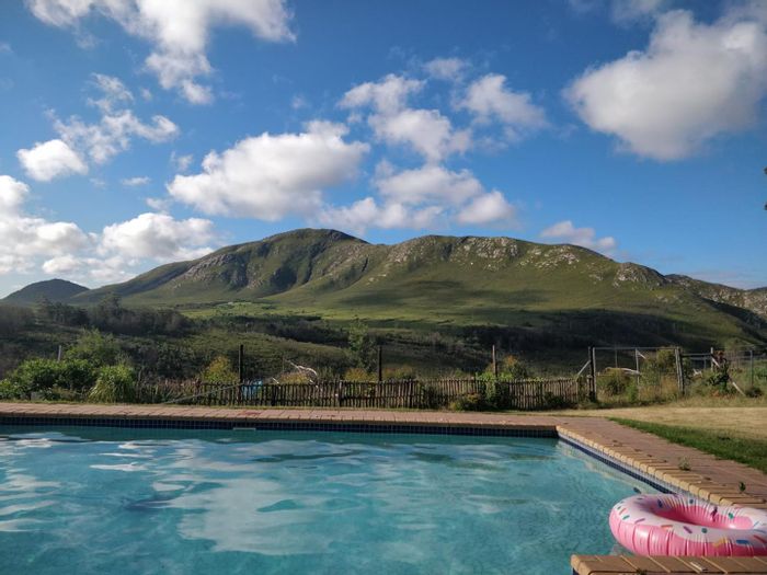 Farm for Sale in Van Stadens: Two houses, pool, braai area, and scenic views.