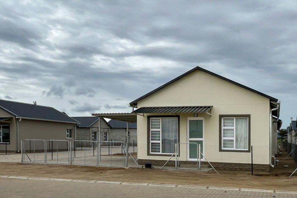 Freestanding townhouse with provision for future expansion and carport.