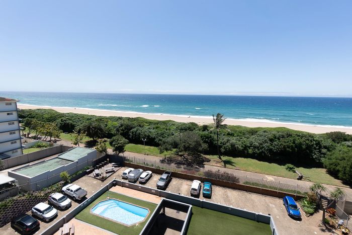 Amanzimtoti Central Apartment For Sale: Ocean views, pool, garage, beach access.