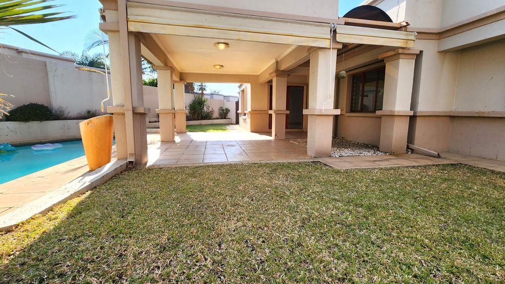 Lawn and large covered entertainment patio.