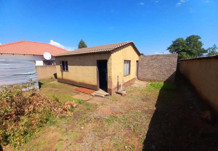 RDP house for sale in Soshanguve South with unfinished building and secure fencing.
