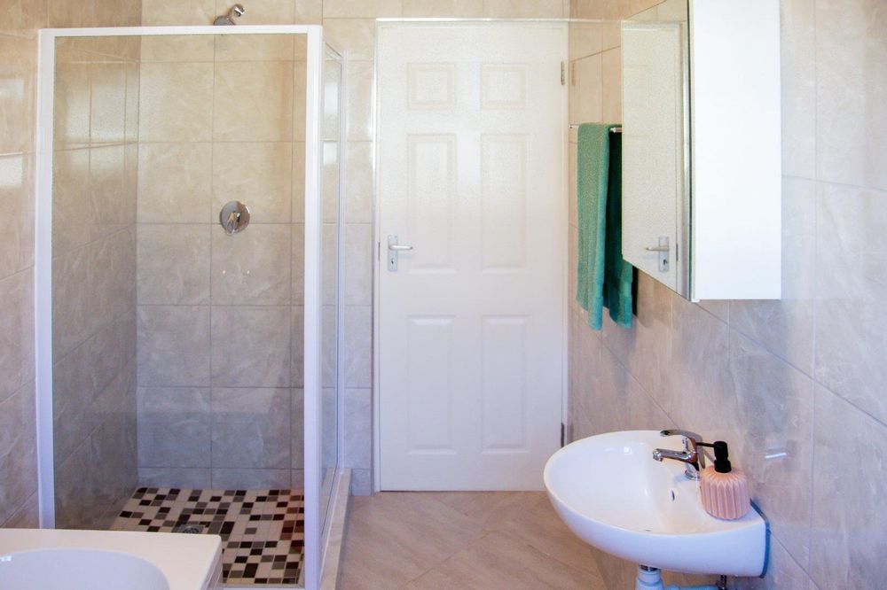 Family bathroom equipped with both shower and bath.