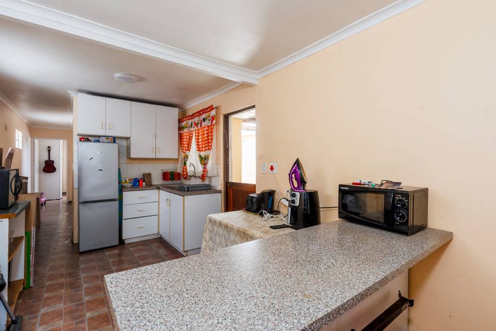 Twodwelling house in Grassy Park with garden, garage, and rental