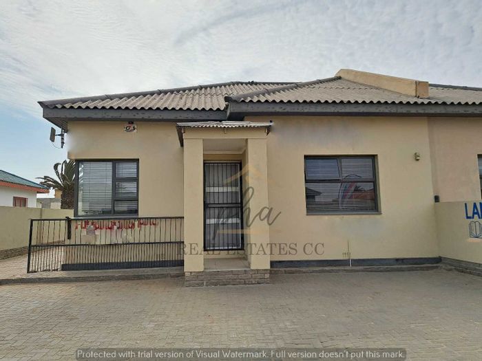 For Sale: Business in Walvis Bay Central with offices, kitchen, parking, and flat.