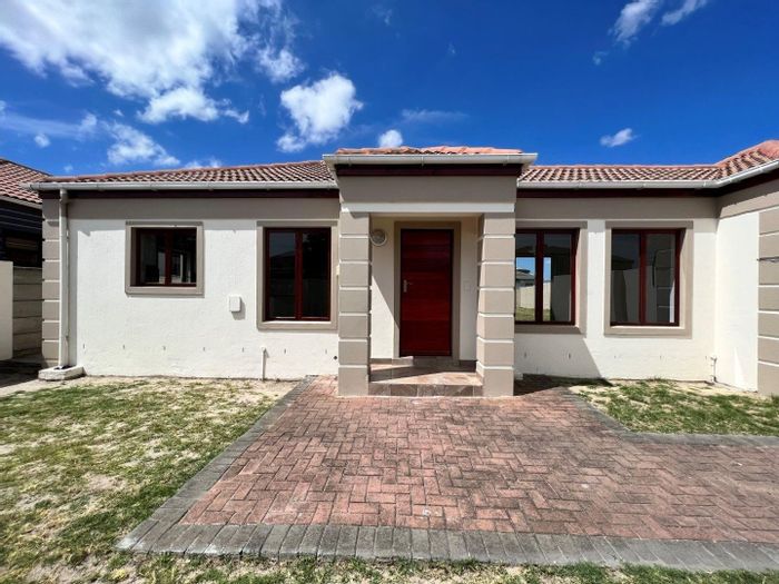 For Sale: House in Parklands with garden oasis, open-plan living, and four bedrooms.