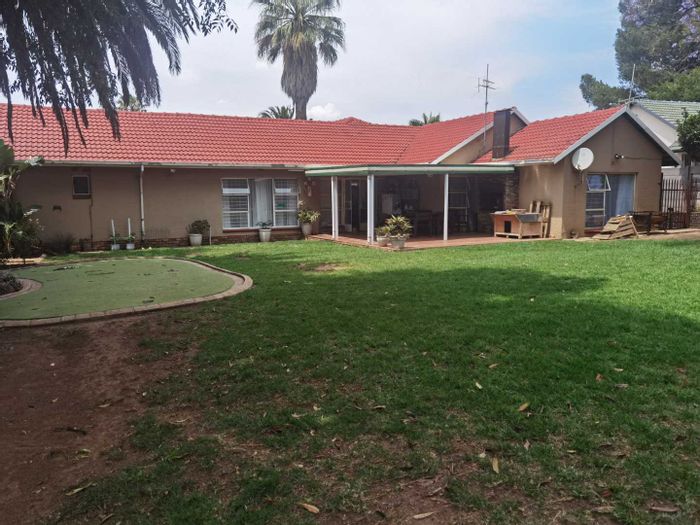 For Sale: House in Van Riebeeck Park, 24-hour security, spacious living areas, ample parking.