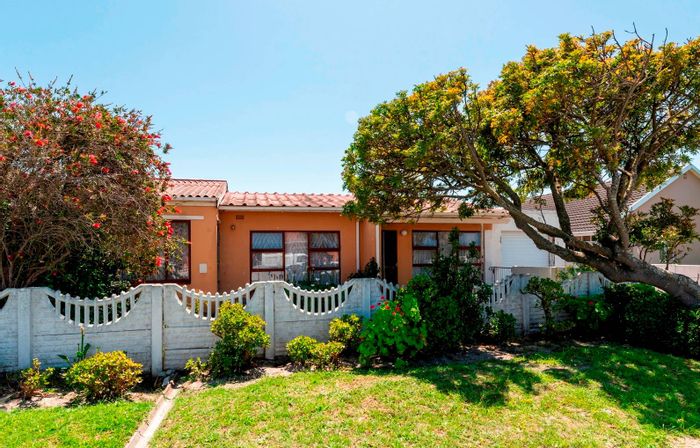 Two-dwelling house in Grassy Park with garden, garage, and rental potential for sale.