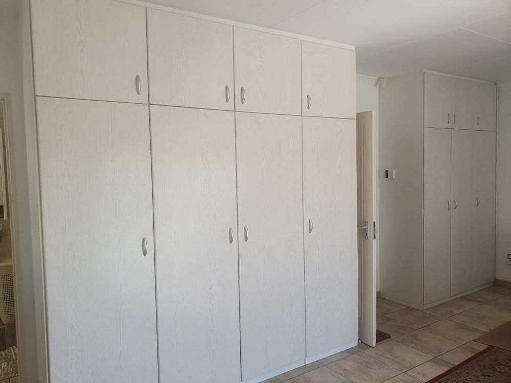 Ample cupboards in main bedroom