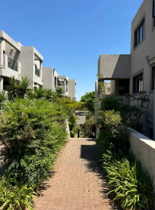 Bryanston Apartment To Rent: 2 bedrooms, secure garage, open parking, vibrant community.