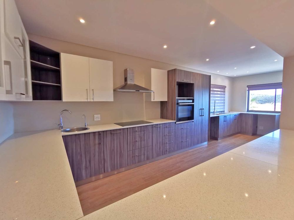 TOP FLOOR LOOKING DOWN TO THE INDOOR GARDEN WITH POOL