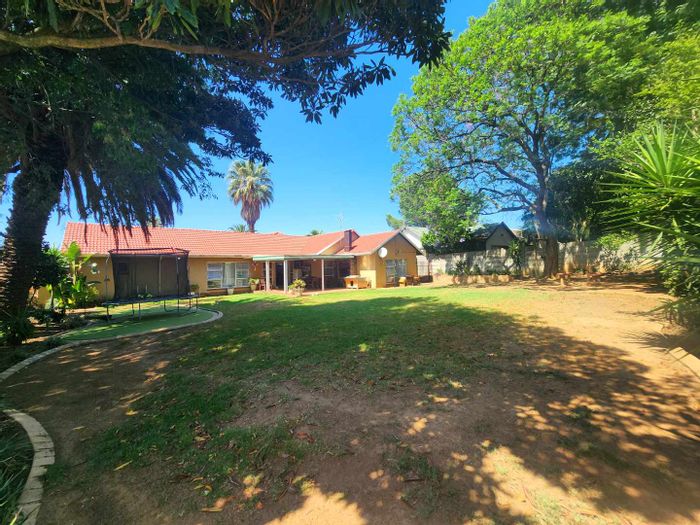 House For Sale in Van Riebeeck Park with putting green and secure parking.