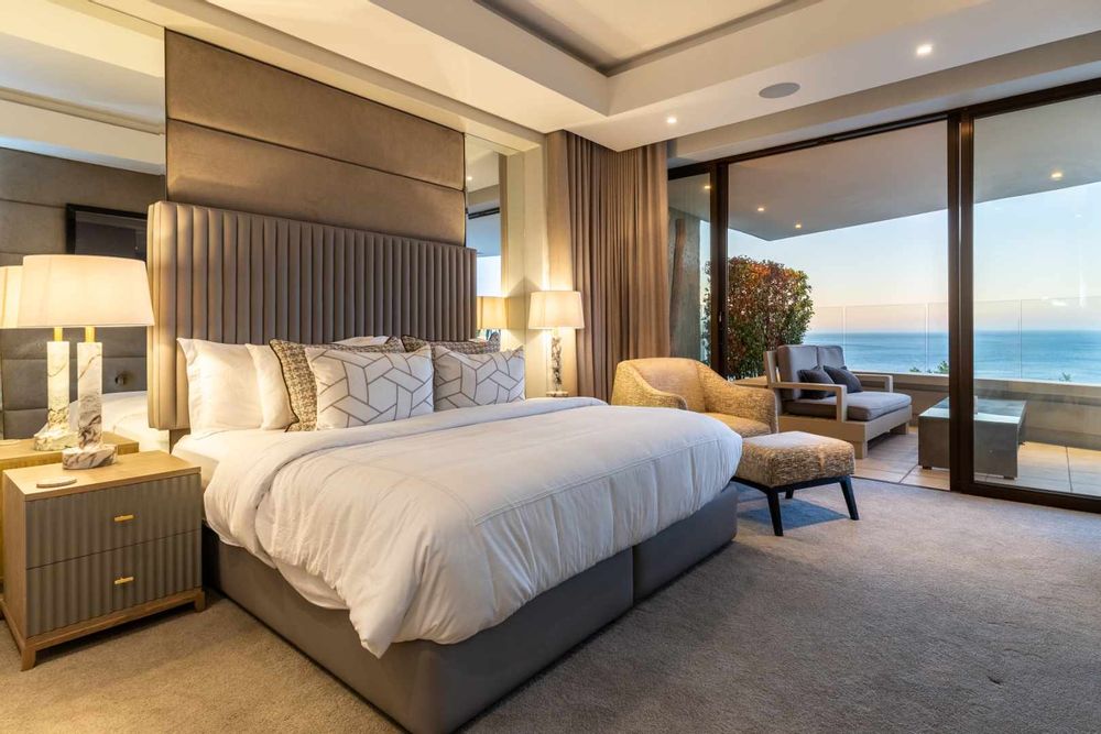 master bedroom with full ensuite bathroom opens onto larger entertainment area & Atantic Ocean views
