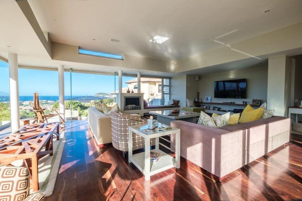 Spacious dining room with fire place and ocean views