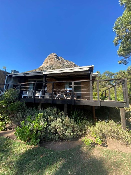 Townhouse For Sale in Gordons Bay Central: Solar power, tidal pool, secure parking.