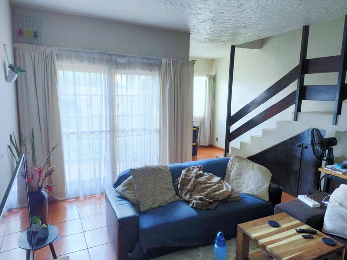 For Sale: Suiderhof Apartment with 2 Bedrooms, Private Garden, and Secure Parking.