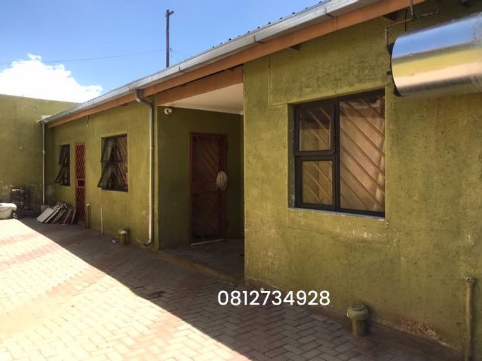 For Sale: Khomasdal House with 3 Bedrooms, Study, Double Garage, and Income-Generating Flats.