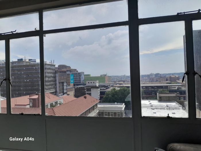 Braamfontein Apartment For Sale: One-bedroom units with balcony, ideal for professionals and students.