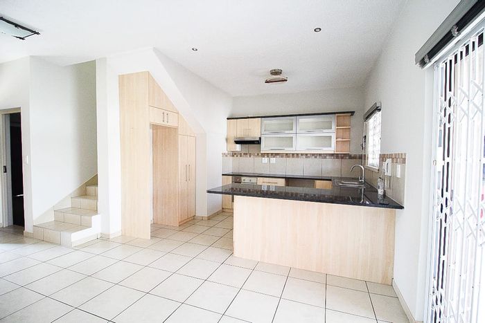 For Sale: Mile 4 Townhouse with 2 Bedrooms, Private Patio, and Secure Complex.