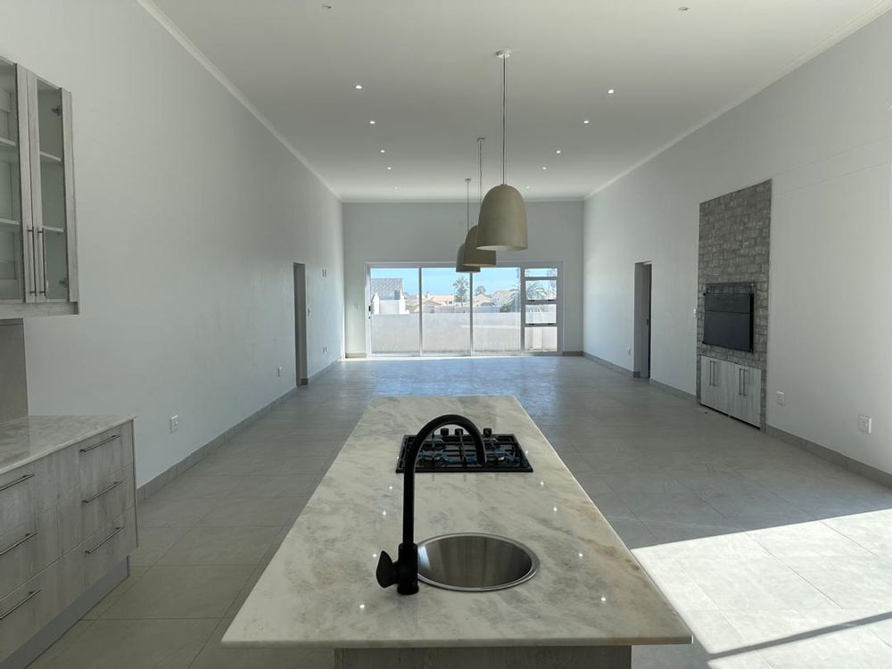 Open plan Kitchen, braai and living area