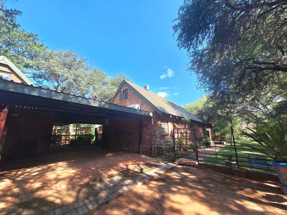 Covered parking adjacent to house