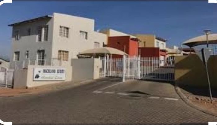 Townhouse For Sale in Rocky Crest: 2 Bedrooms, courtyard, secure parking, ideal for investors.